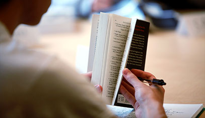 Image of someone holding a book.