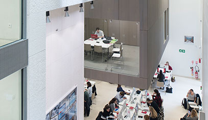 Image of students work in a computer lab.